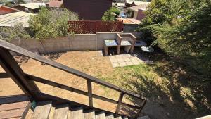 an overhead view of a patio with a table and a bench at Cabaña Las Cruces in Las Cruces