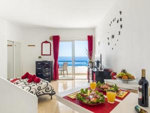 a living room with a table with a plate of food at 1316 Paraiso Sur, Amazing view in Playa Paraiso
