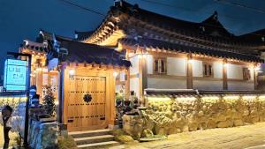 a building with lights on the side of it at 나들한옥 한옥스테이 in Gyeongju +39 photos