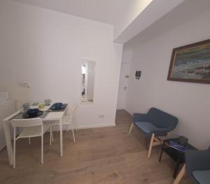 a living room with a table and chairs at Athalassas corner in Strovolos