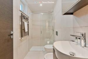 a bathroom with a sink and a toilet and a shower at Cà del Magra, TerreMarine in Santo Stefano di Magra +8 photos