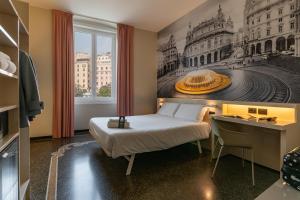 a bedroom with a bed and a desk and a picture at B&B Hotel Genova Principe in Genoa