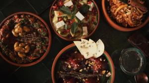 a group of bowls of food on a table at The Mellah Hotel in Marrakesh