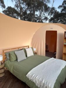 a bedroom with a bed in a tent at Romantic Stargazing Getaway - Beyond Bubbles in Kanimbla