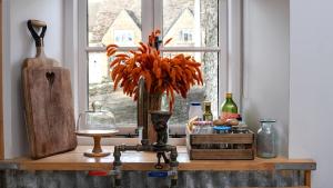 a counter with a window and a vase on it at Filly Island in South Cerney +14 photos