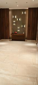 a large room with a stage and a large wooden floor at New Cozy Studio Apartment in Cebu City