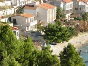 a group of houses on a hill with trees at 230 MESTRO in Stanići
