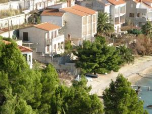 a group of houses on a hill with trees at 230 MESTRO in Stanići