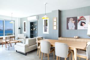 a dining room with a table and chairs at Villa Azure Heaven in Turgutreis