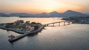 an aerial view of a bridge over a body of water at tongyeong haegando pension in Tongyeong +2 photos