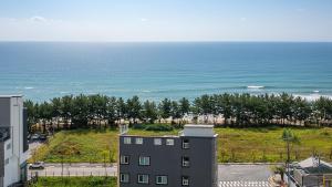 a view of the ocean from a building at Sokcho pensionbyeol in Sokcho
