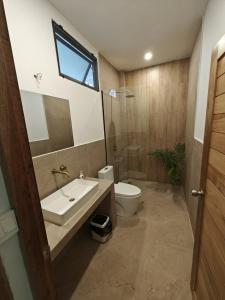 a bathroom with a sink and a toilet and a window at Ganesha Mouse House in Ko Phangan +17 photos