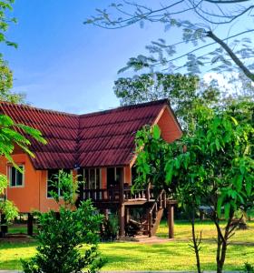 a house with a red roof at Bang Yan Rimlay in Ko Yao Noi