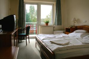 Postel nebo postele na pokoji v ubytování Well Hotel