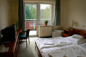 Postel nebo postele na pokoji v ubytování Well Hotel + 18 fotografií