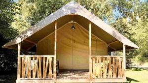 a large yellow tent with a large roof at Lodge Mini-Wood in Les Rochettes +3 photos