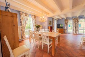 a dining room with a table and chairs at Ferienhaus Möwe in Krienke