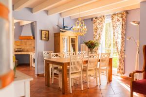 a dining room with a table and chairs at Ferienhaus Möwe in Krienke +20 photos