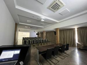 a conference room with chairs and a table and a laptop at Hôtel Volubilis in Fez +45 photos