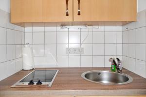 a kitchen counter with a sink and a sink at Rugstieg 8 Whg 2 in Wyk auf Föhr