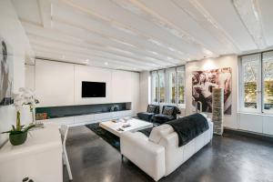 a living room with a couch and a table at Fontaine in Geneva