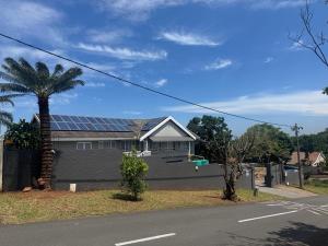 a house with solar panels on top of it at G - Boutique in Durban