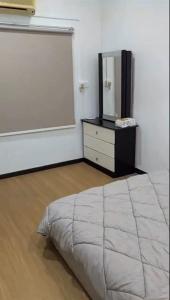 a bedroom with a bed and a mirror and a chalkboard at LIY Homestay in Gua Sai