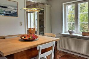 a kitchen with a table with a bowl on it at Süderende- Hus Lillesol in Süderende