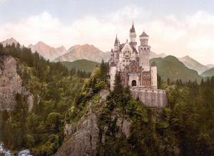 a castle on the side of a mountain at Hotel Füssen in Füssen