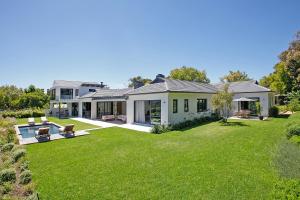 a house with a large yard with a pool at Table Mountain Constantiaberg view in Sweet Valley