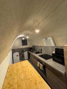 a kitchen with a sink and a counter top at Blue house in Saint-Gilles
