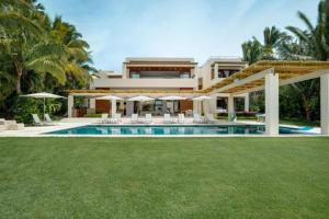 an exterior view of a house with a swimming pool at Villa Buho in Punta Mita in Punta Mita