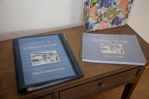 two boxes sitting on top of a dresser at La Bonne Vie Gite in Chaunay