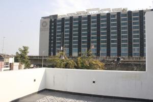 a tall building with a white wall in front of it at Ratan Vilas in Jaipur
