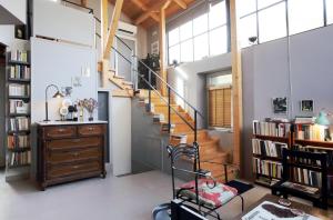 a staircase in a room with a book shelf at eliamaria artistic house in Lefkada
