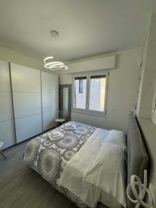 a bedroom with a large bed in a room at A casa di Ada in Finale Ligure