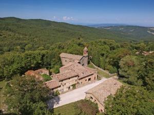 an aerial view of an old house with a church at Casa Giulio in Vivo dʼOrcia