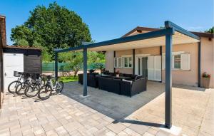 a house with bikes parked on a patio at Gorgeous Home In Rovinj in Rovinj