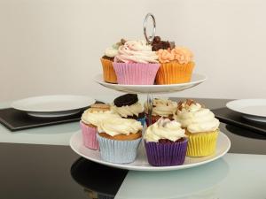 a three tiered plate of cupcakes on a table at Blue Star House in Portsmouth +14 photos