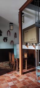 a dining room with a table and chairs at APARTAMENTO La CAVA in Guadalcanal +6 photos