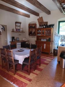 a kitchen and dining room with a table and chairs at Barthmühle in Klipphausen