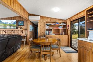a dining room with a table and chairs at The Meadowlark Cabin in Big Arm