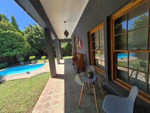 a house with a patio and a swimming pool at 12 On Milner in Kimberley