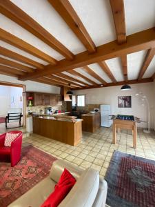 a living room with a couch and a table at Gîte 4 Le Cerizay - proche du PuyduFou in Cerizay