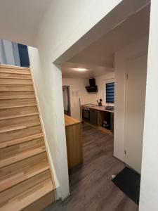 a stairway leading to a kitchen in a room at Ferienwohnung Nabo in Wadgassen