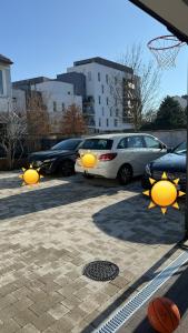 a group of cars parked in a parking lot at Maison centre-ville in Dijon