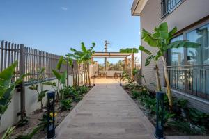 a walkway leading to a patio in a house at Moon Shine Apart in Altınkum
