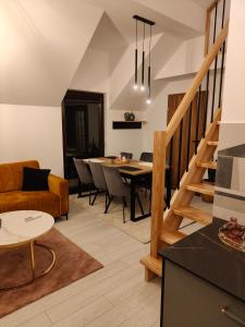 a living room with a couch and a table at Pienińskie Zacisze in Jaworki
