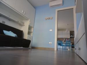 Televízia a/alebo spoločenská miestnosť v ubytovaní Casa Azzurra
