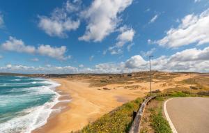 a beach with a street light next to the ocean at Casa Mario in Torre Dei Corsari